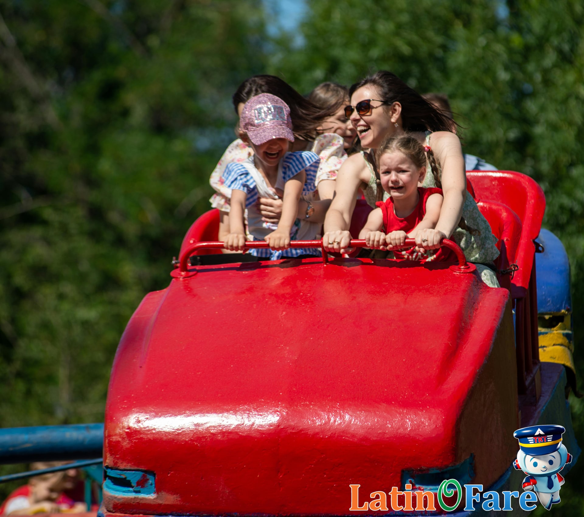 Family exploring a famous theme park during June summer vacation, perfect for family travelers.