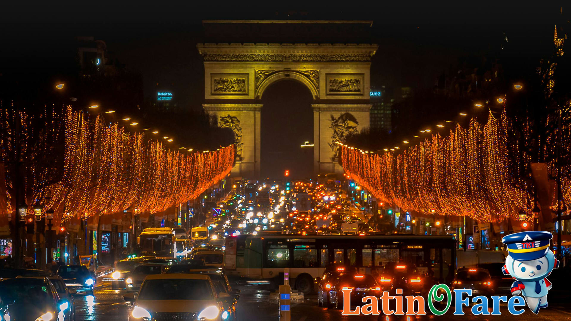 Famous city street sparkling with Christmas travel holiday lights in Paris at night