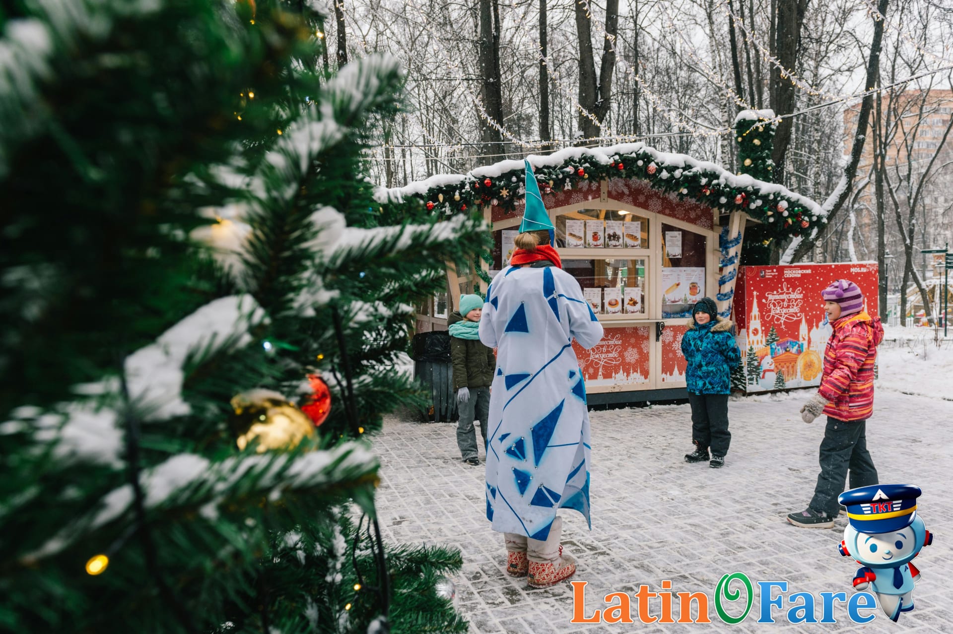 Kids marveling at holiday lights on Christmas travel adventure outdoors with families