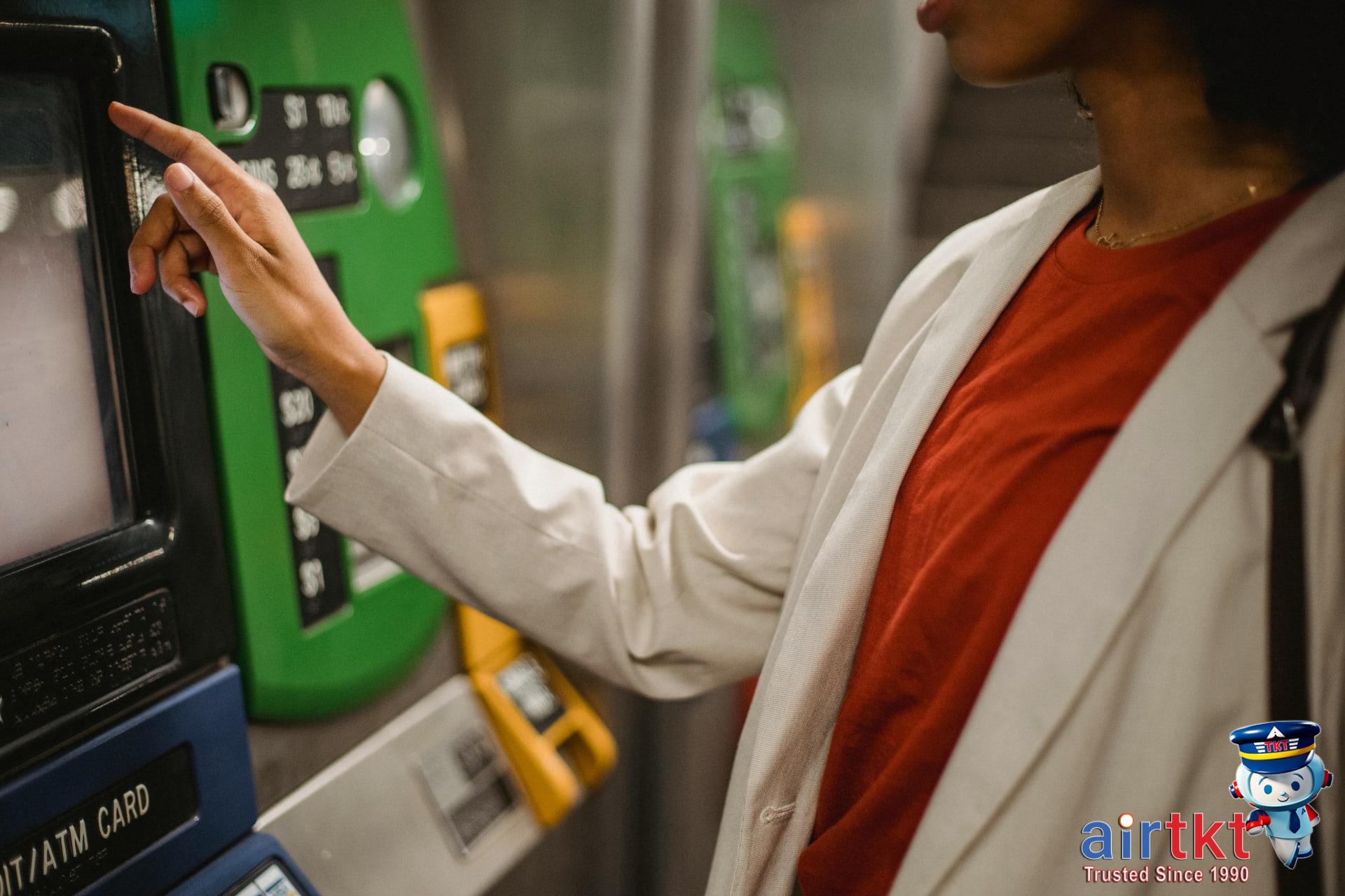 Tourist using Miami transit ticket machine at station kiosk for pass