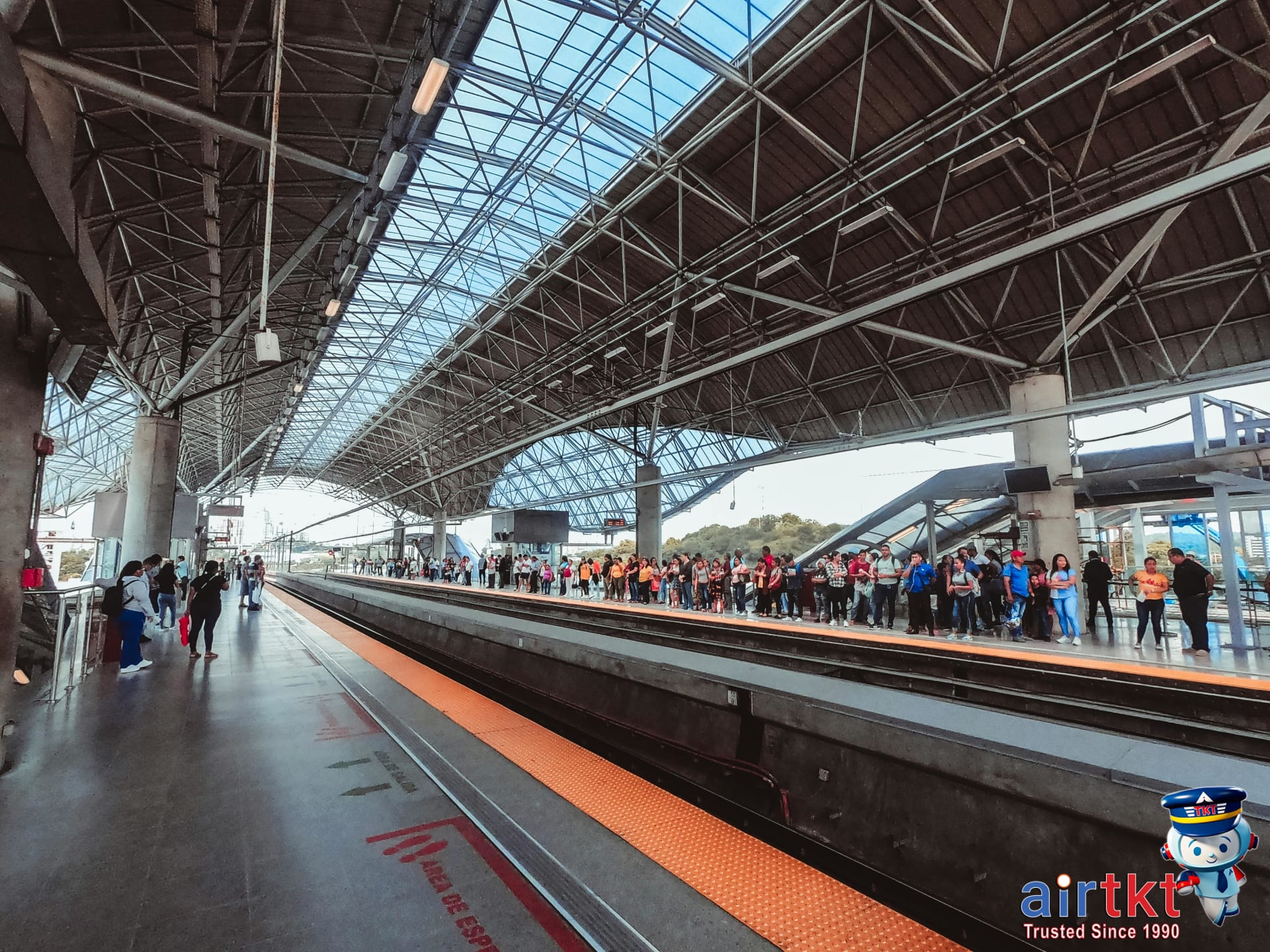 Miami Metromover passengers waiting on platform for arriving vehicle