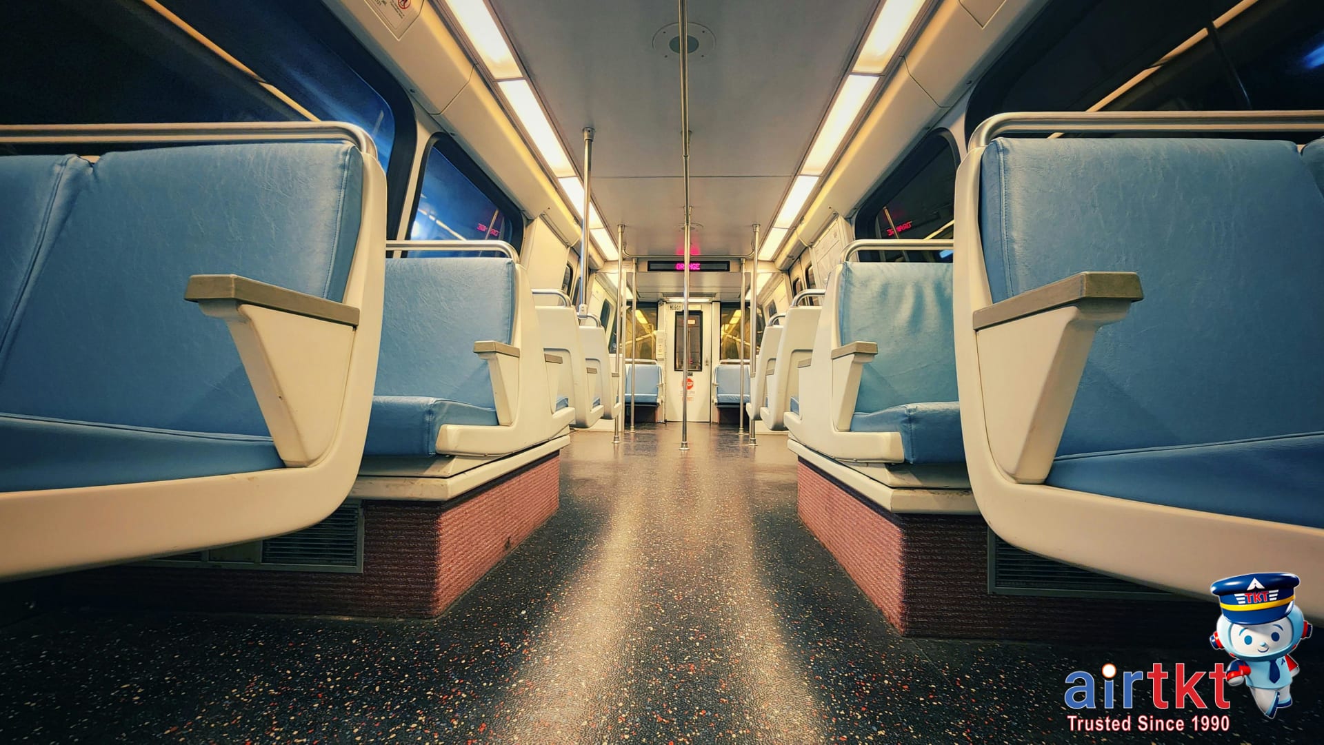Inside view of Miami Metrorail transit car interior showing seats and signage