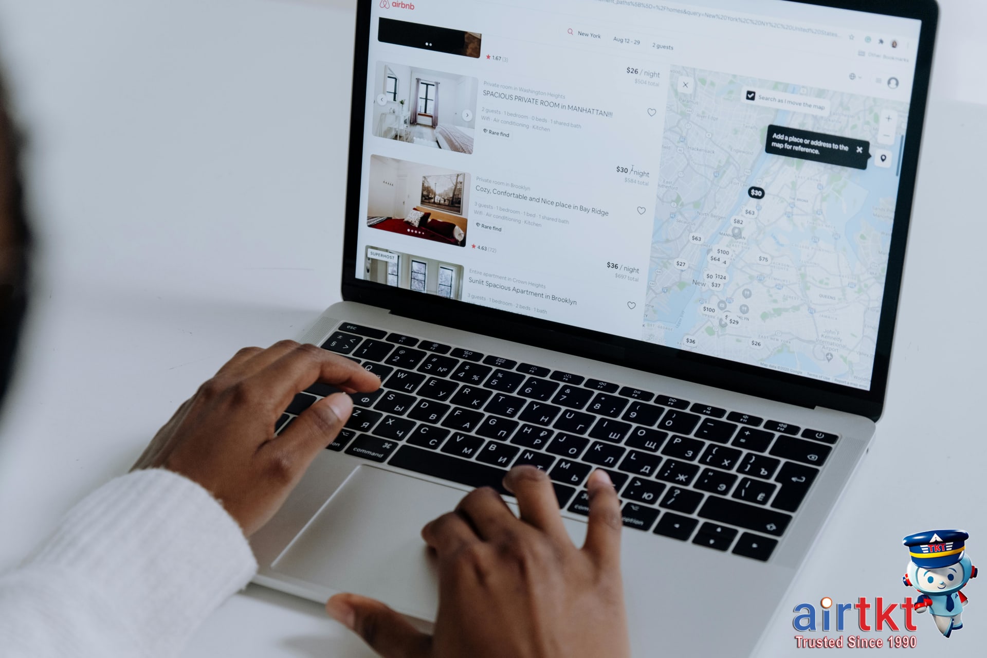 User utilizing flexible date search feature on travel website on laptop
