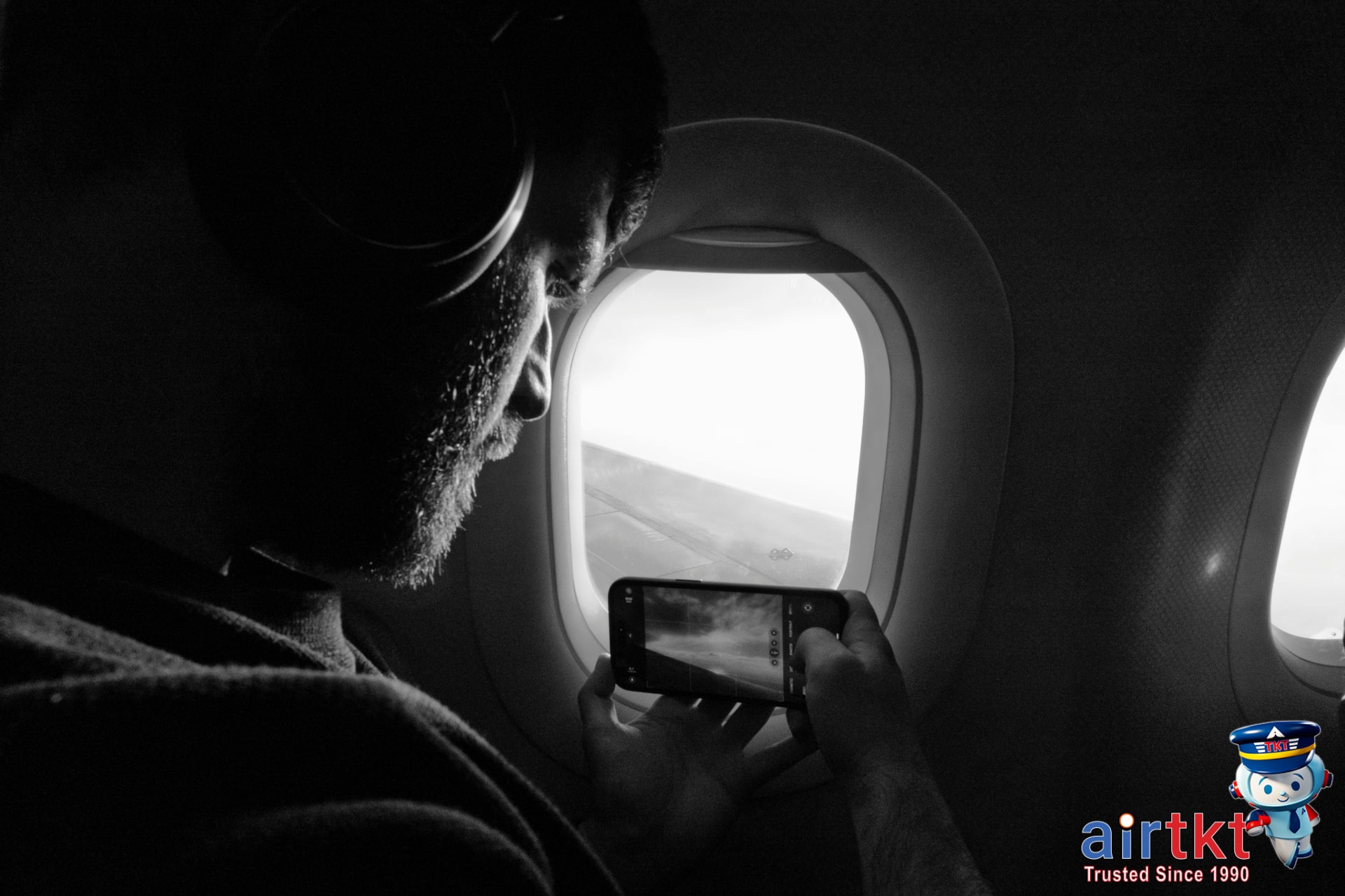 Traveler comparing prices across OTA apps for cheap flight deals on smartphone