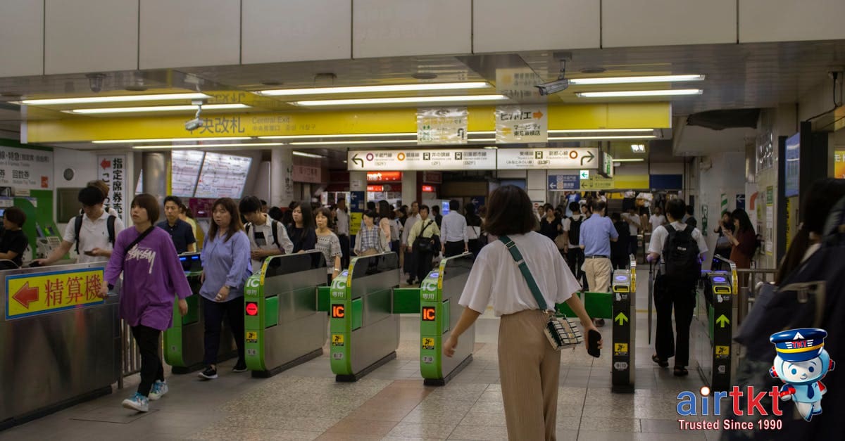 Tokyo metro station transit system commuters and trains at platform