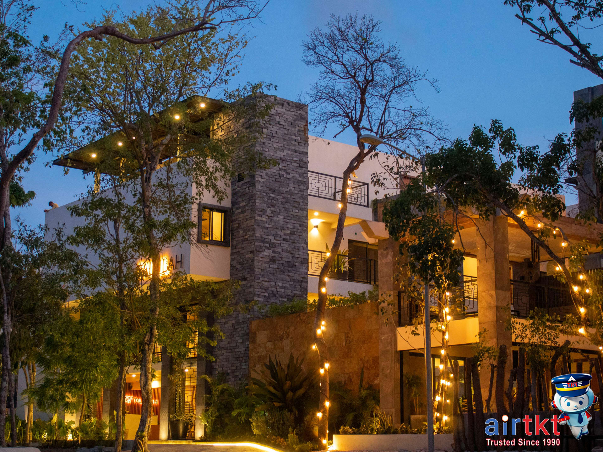 Cozy hotel accommodation for Mother's Day getaway with warm lights at twilight