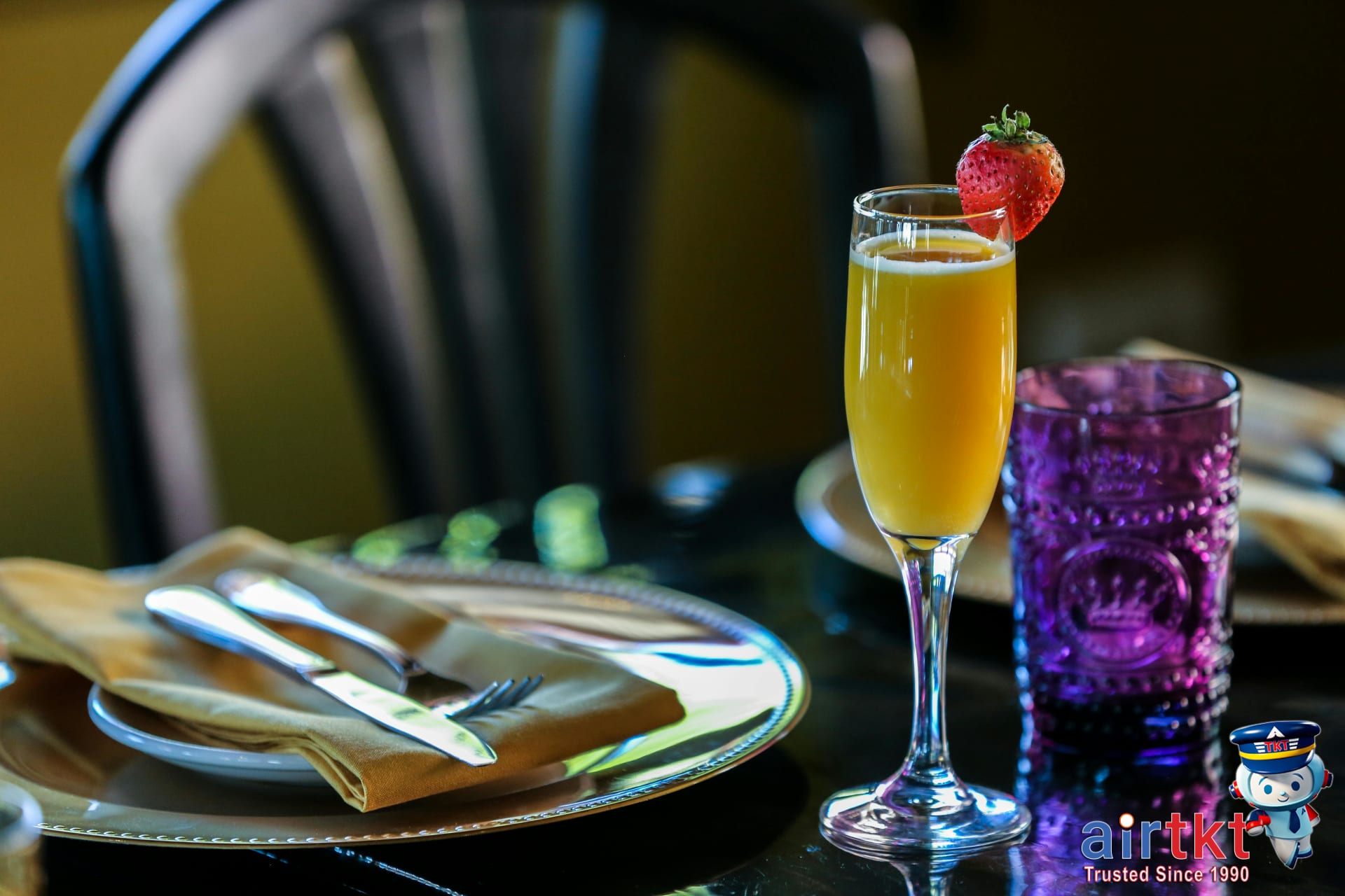 Mother's Day brunch with mimosas and colorful dishes set on city table