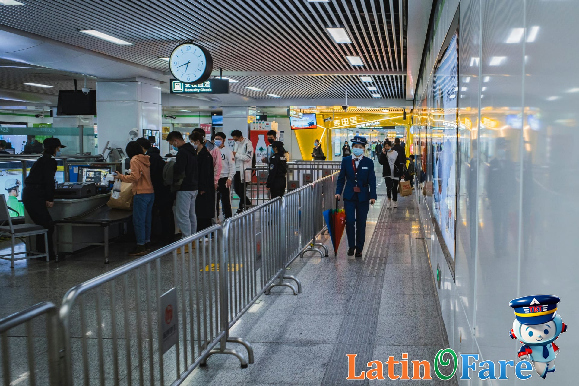 Airport staff assisting stranded airline passengers at gate discussing passenger rights and options.