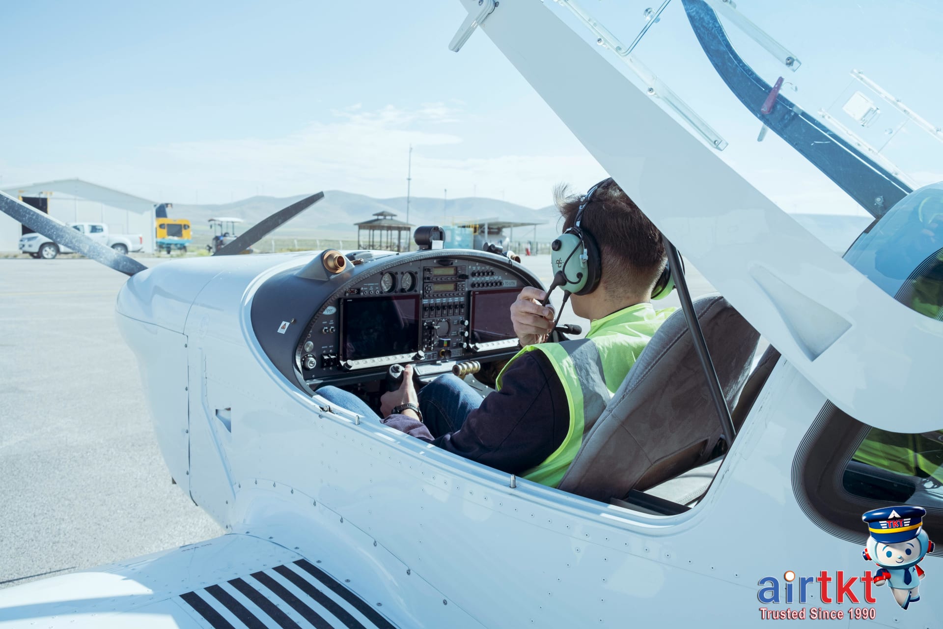 Pilot in cockpit showing how fuel costs influence airline pricing