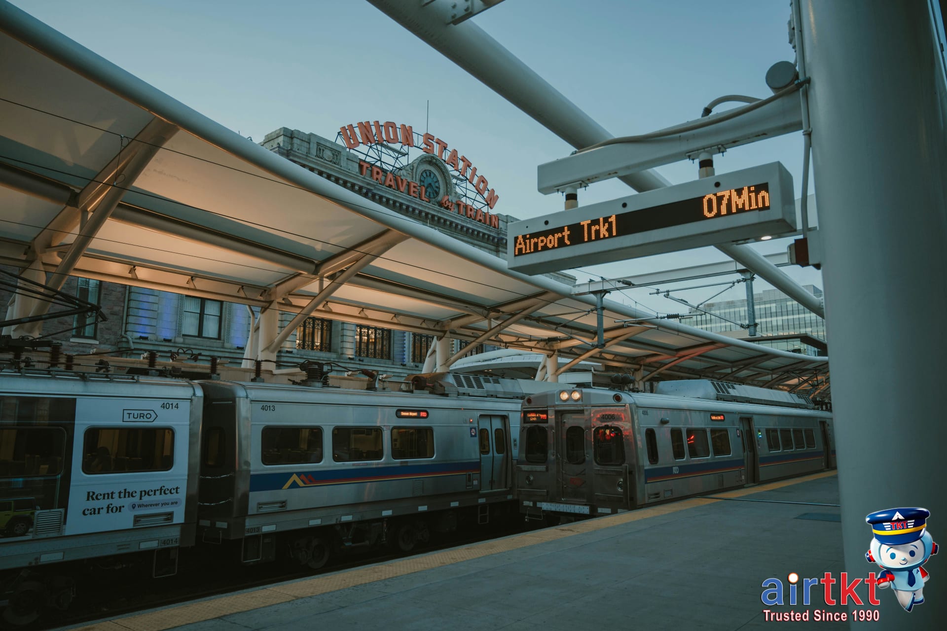 Denver light rail train traveling through modern urban streetscape in the heart of downtown