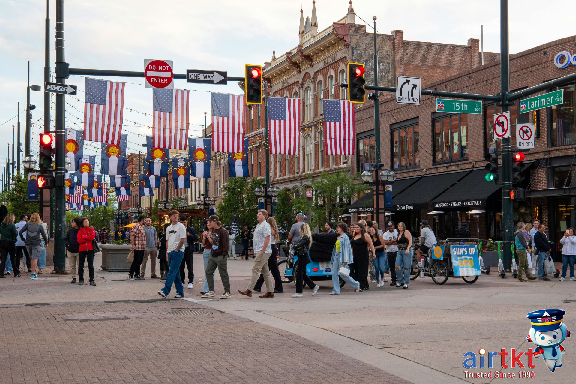 Busy street scene with people shopping on Denver's lively 16th Street Mall