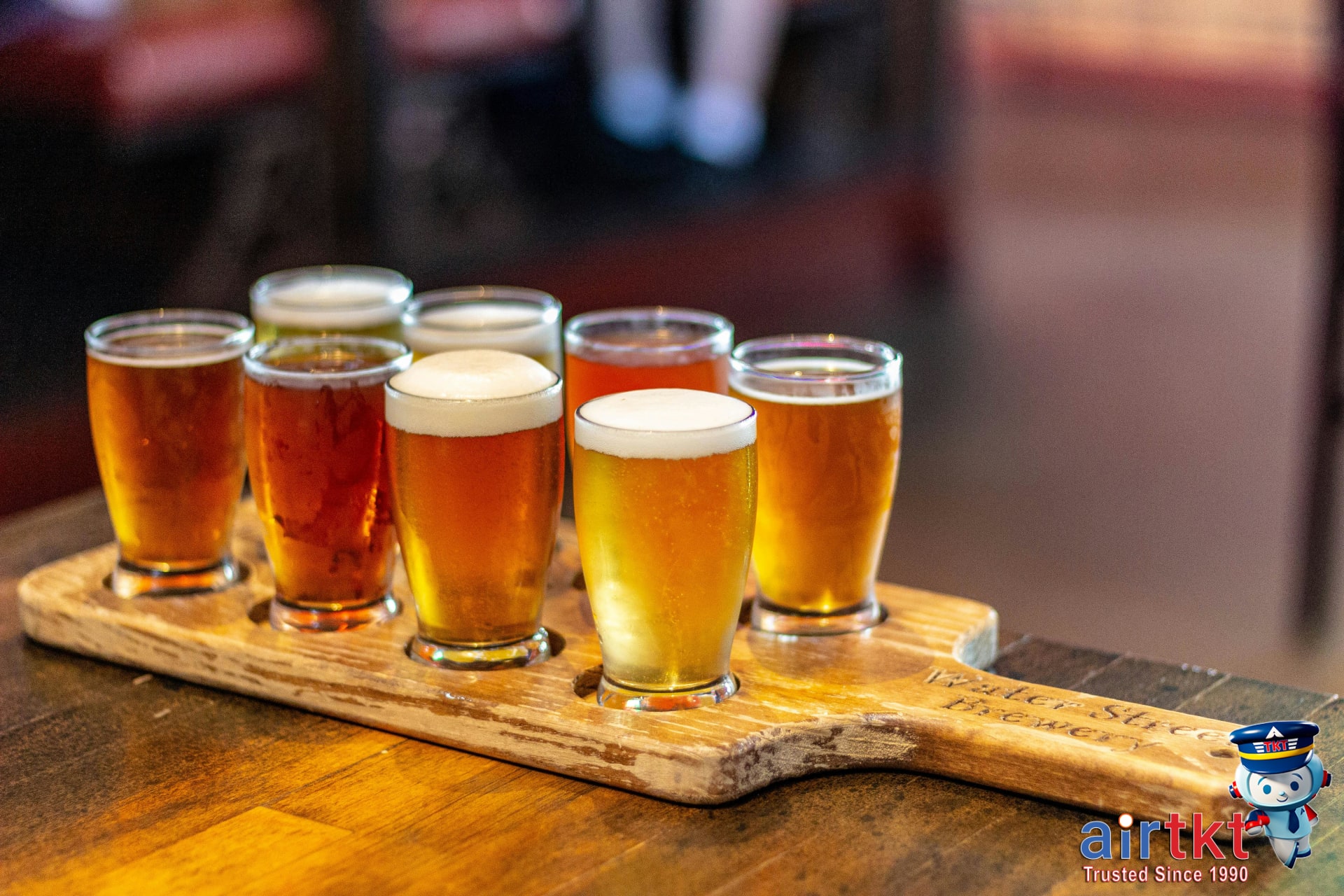 Sampling craft beer in cozy Denver brewery taproom with wooden table