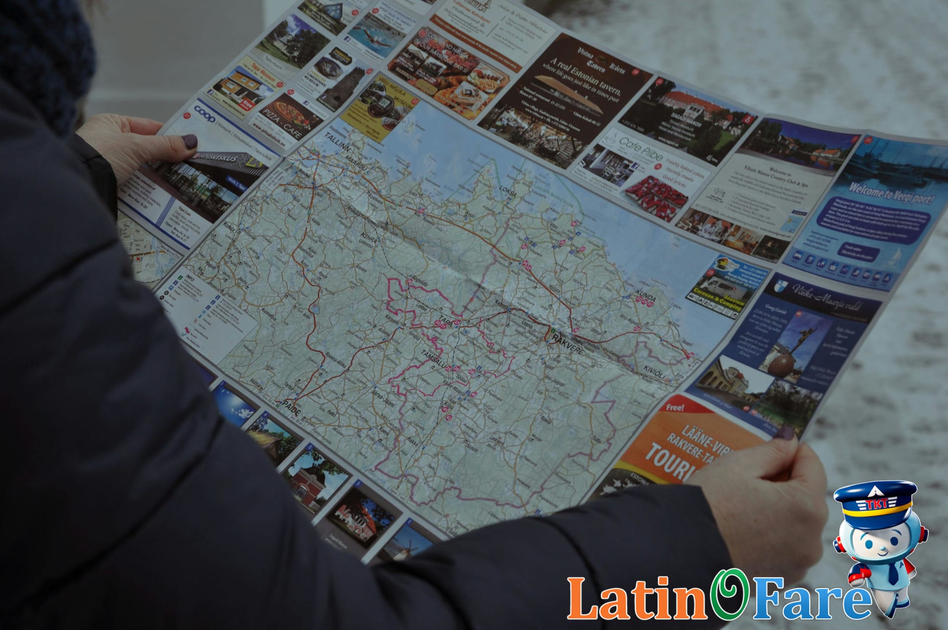 Travelers reviewing dry season safari route maps and transport options before booking.