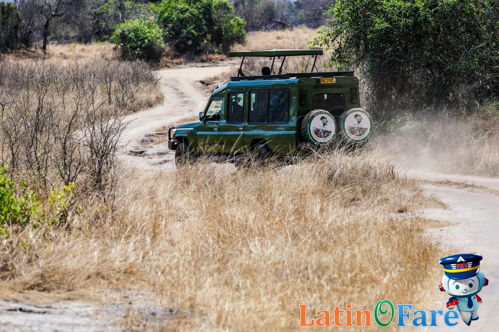 Safari vehicle driving through Africa’s dry season savanna for optimal Big Five sightings.