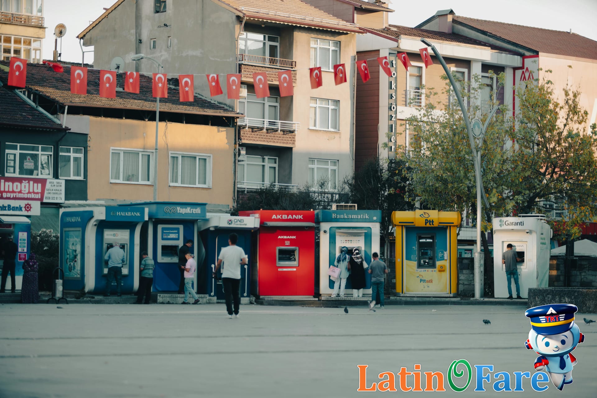 Withdrawing travel currency from a local ATM to avoid high exchange booth fees.