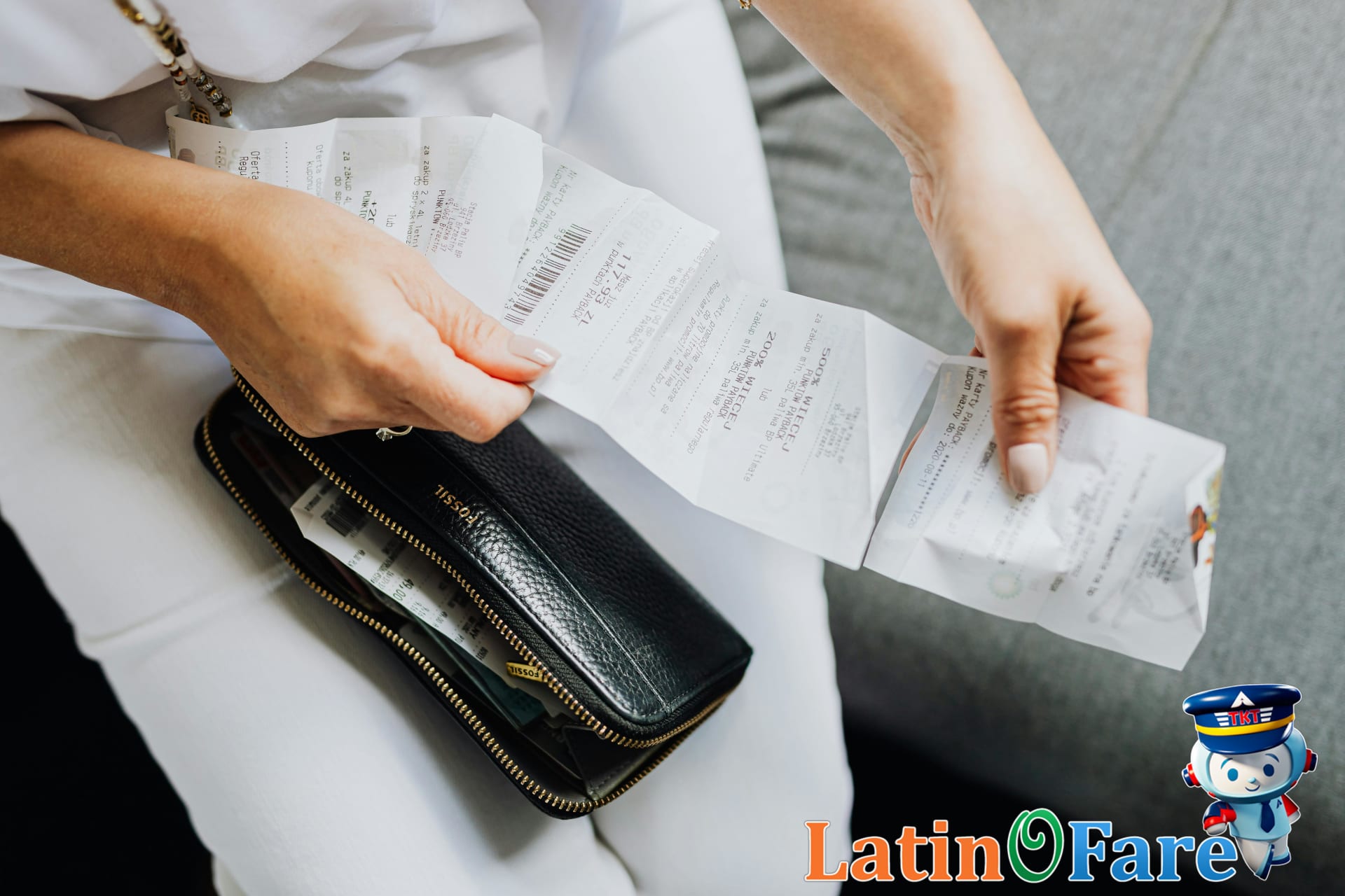 Budget traveler organizing cash after withdrawing from an ATM to minimize fees