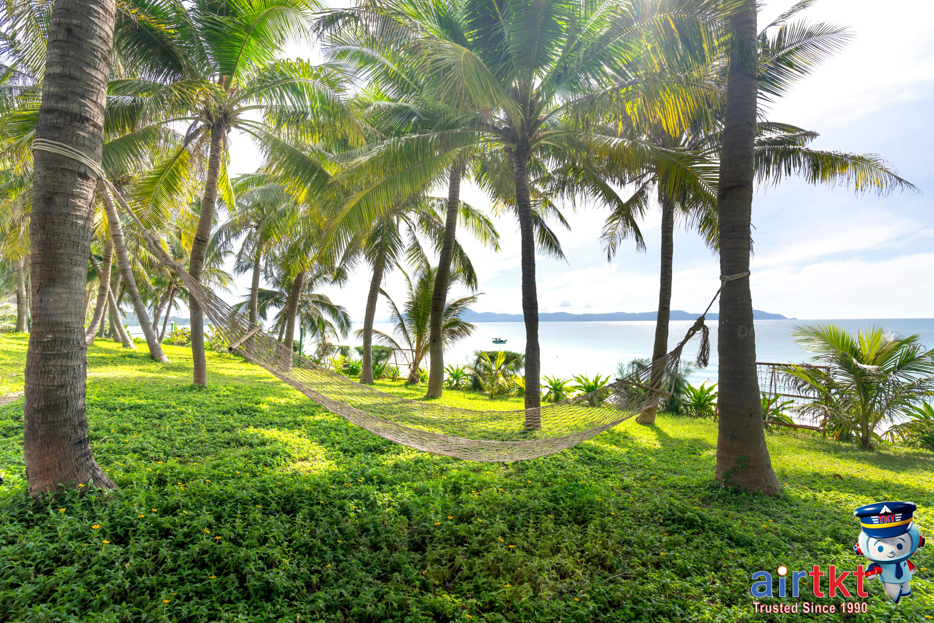 Hammock under coconut trees with ocean view at Troncones beach, Mexico
