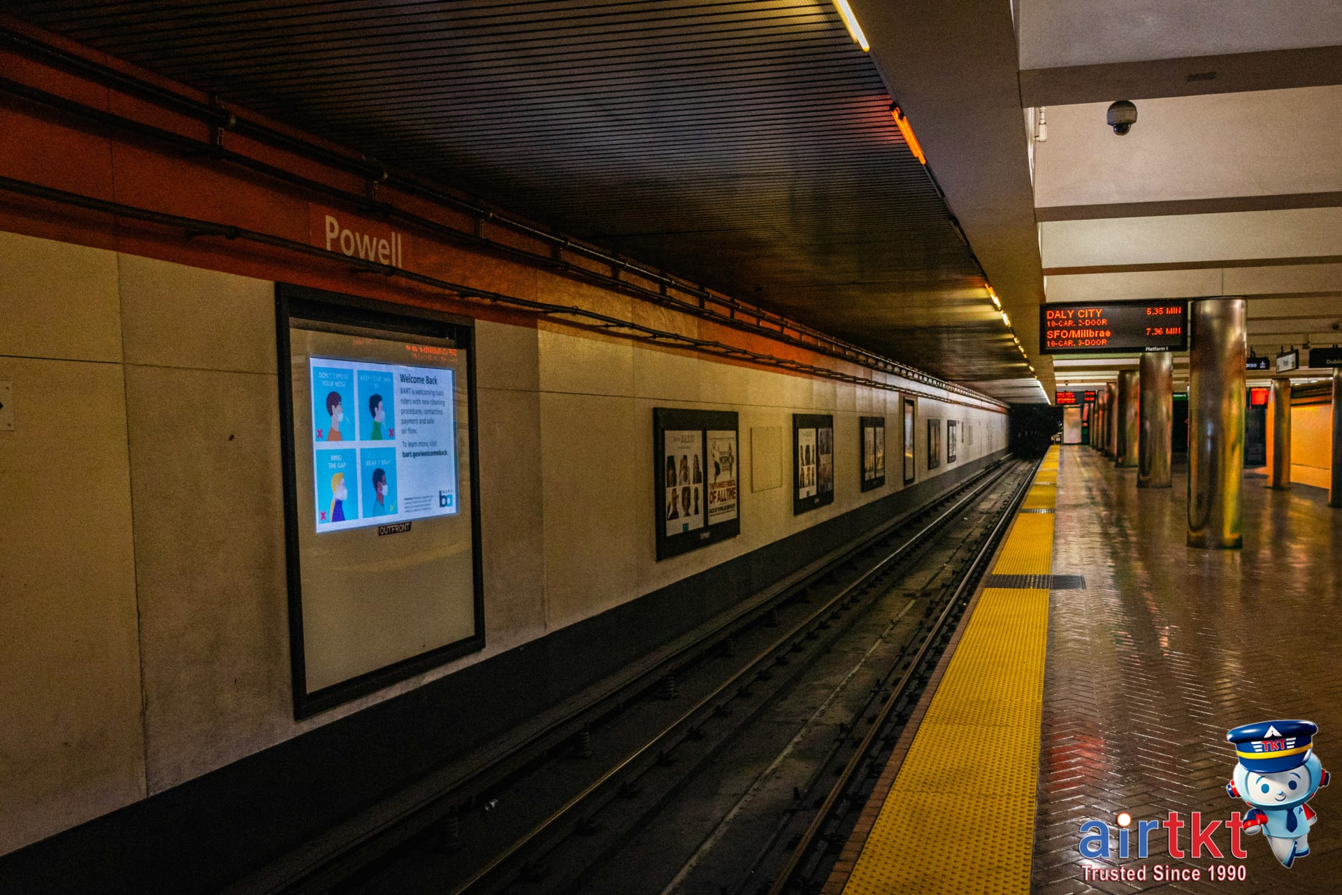 Traveler using transit app in San Francisco while waiting for a Muni bus