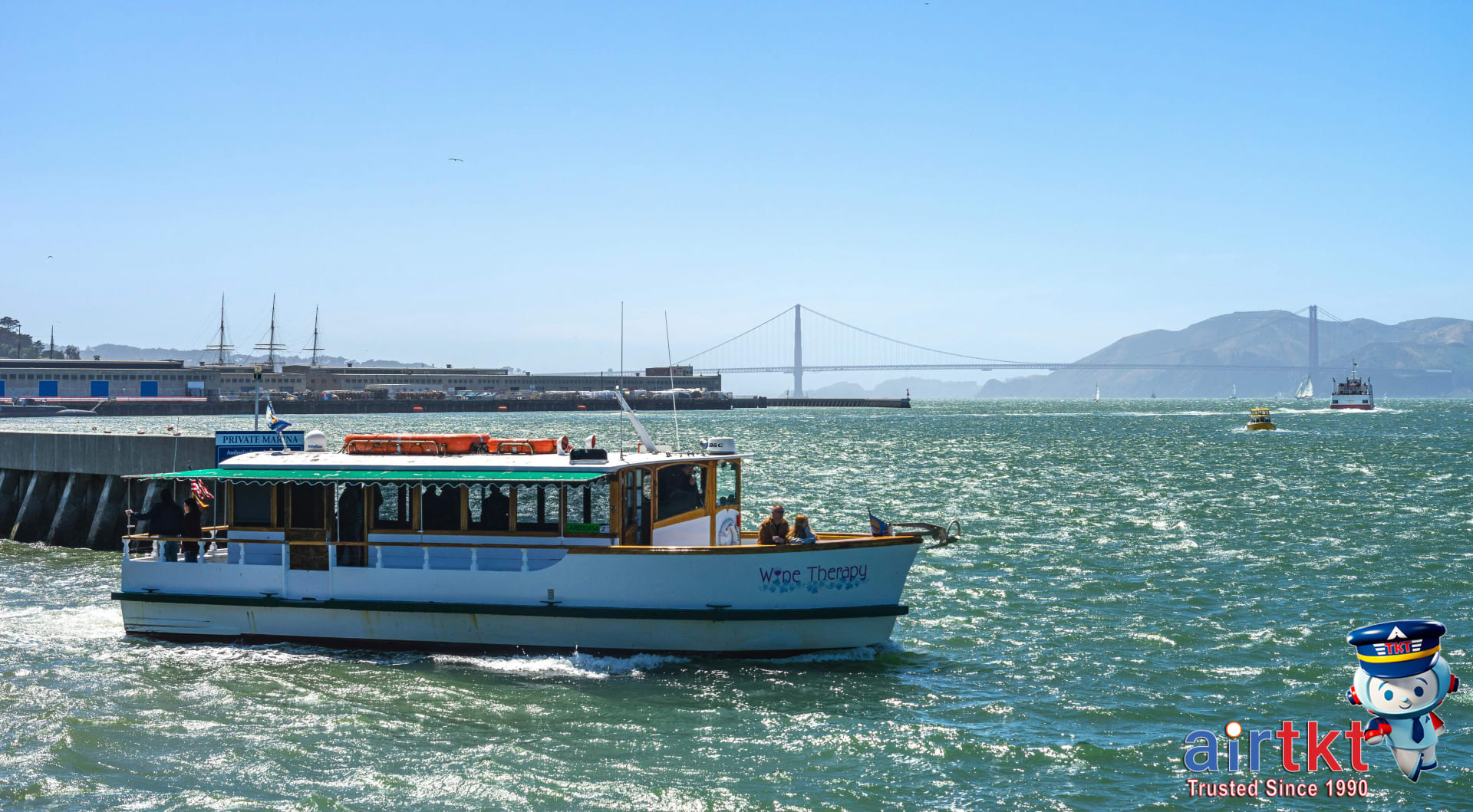 Ferry cruising San Francisco Bay with Golden Gate Bridge
