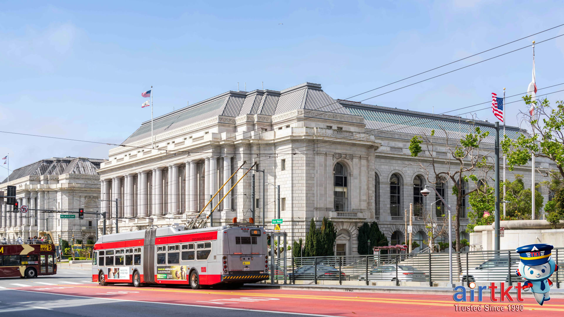 San Francisco public transit with Muni train and cable car in city