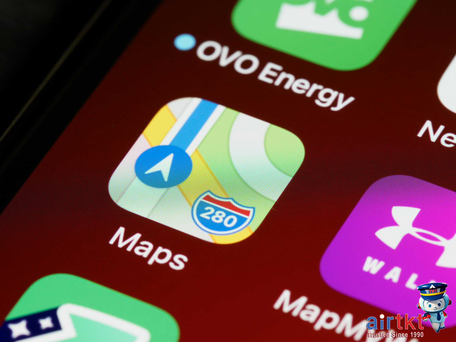 Offline maps and guides on mobile travel app while seated on airplane