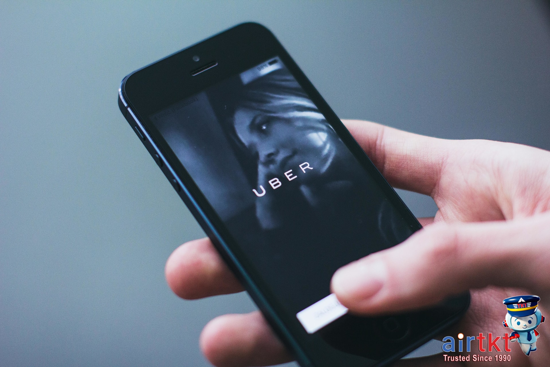 Mobile phone displaying car rental options to avoid young driver fees