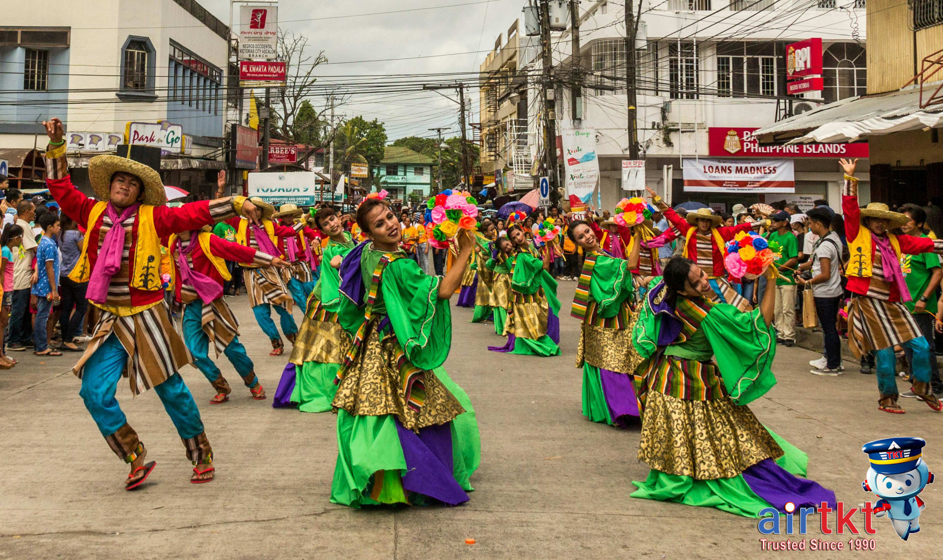 Street parade with cultural dancers celebrating Philippine Independence Day joyfully