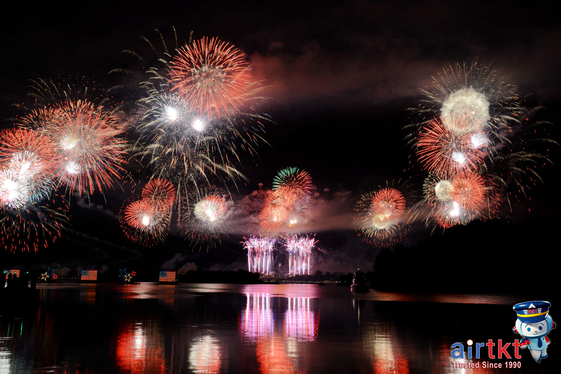 Philippine flag flying high during Independence Day celebrations with fireworks