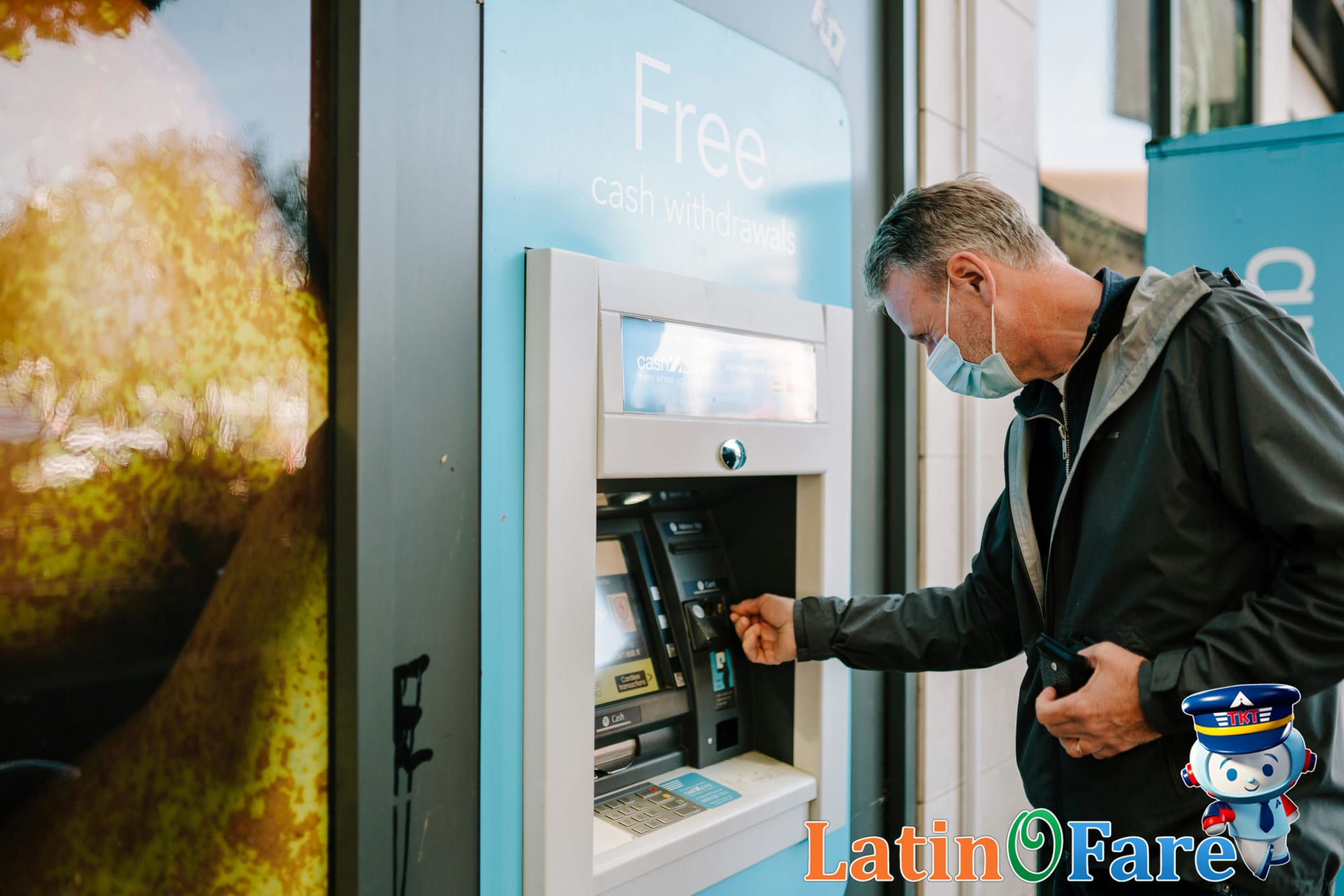 Traveler uses bank ATM safely to prevent common cash and currency exchange scams abroad.