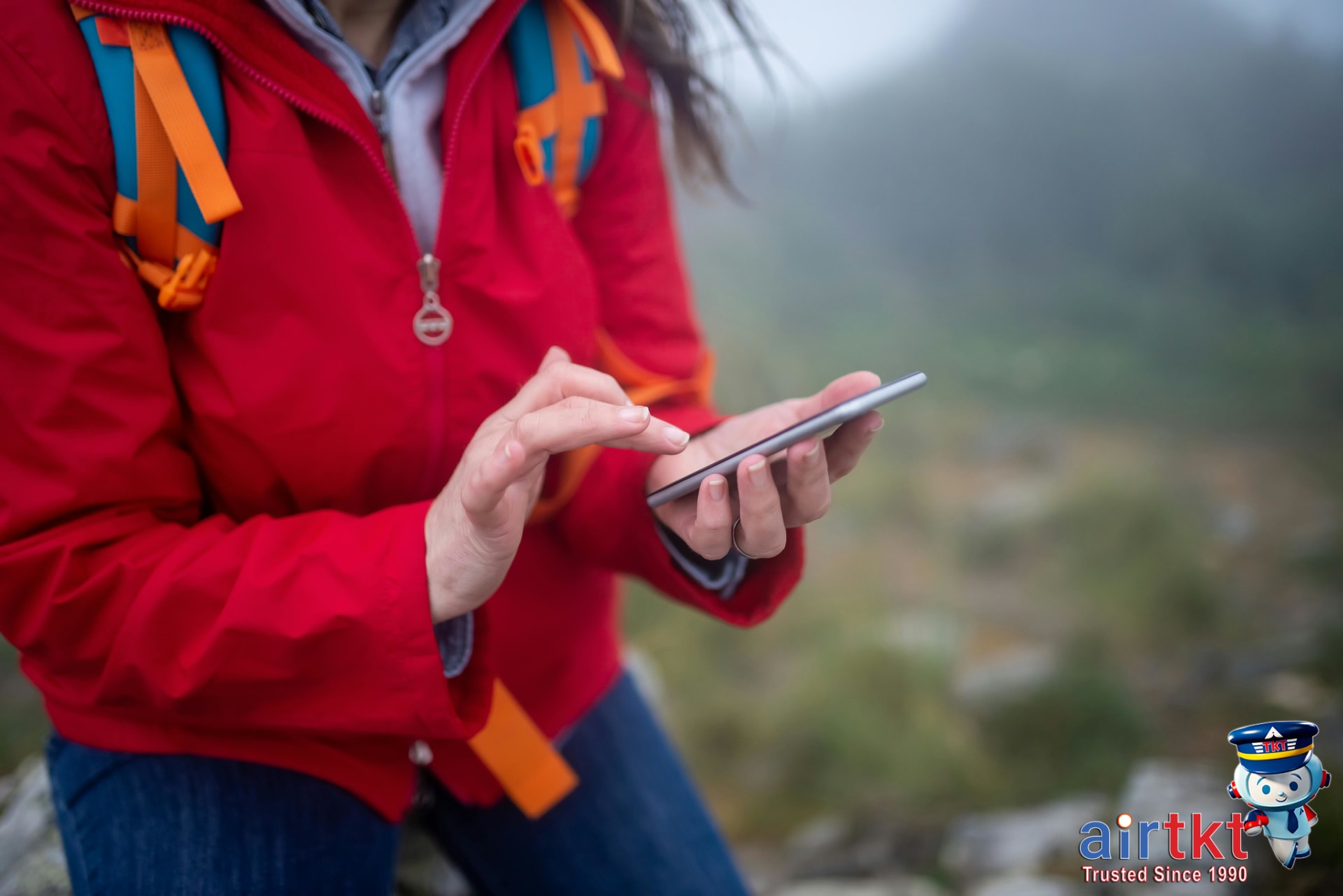 Traveler using flight booking tips to find airfare deals on smartphone app