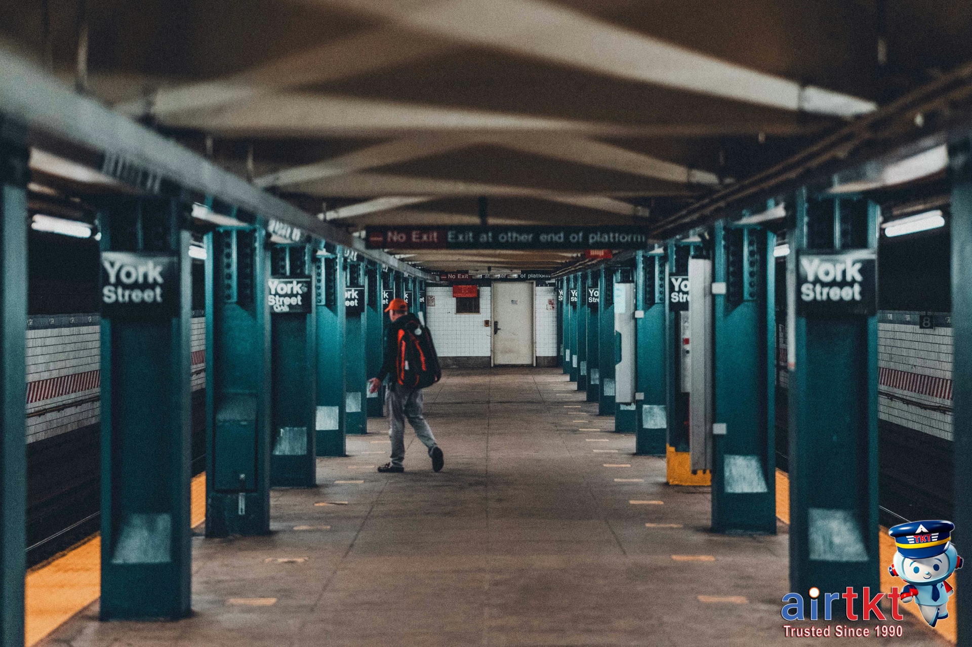 Local New Yorker boarding NYC subway train during morning commute rush