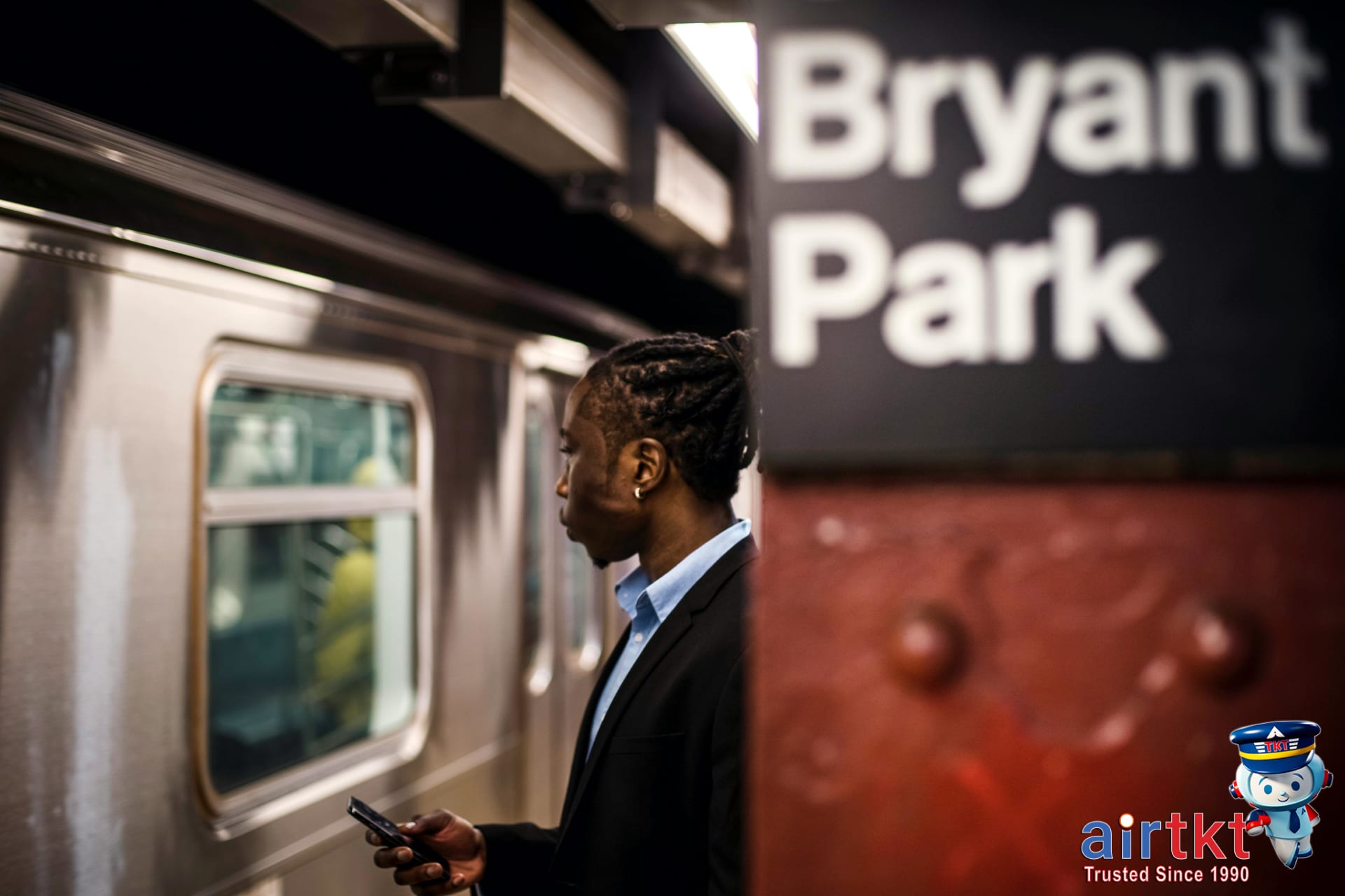 Commuter using MTA app on smartphone for NYC transit information