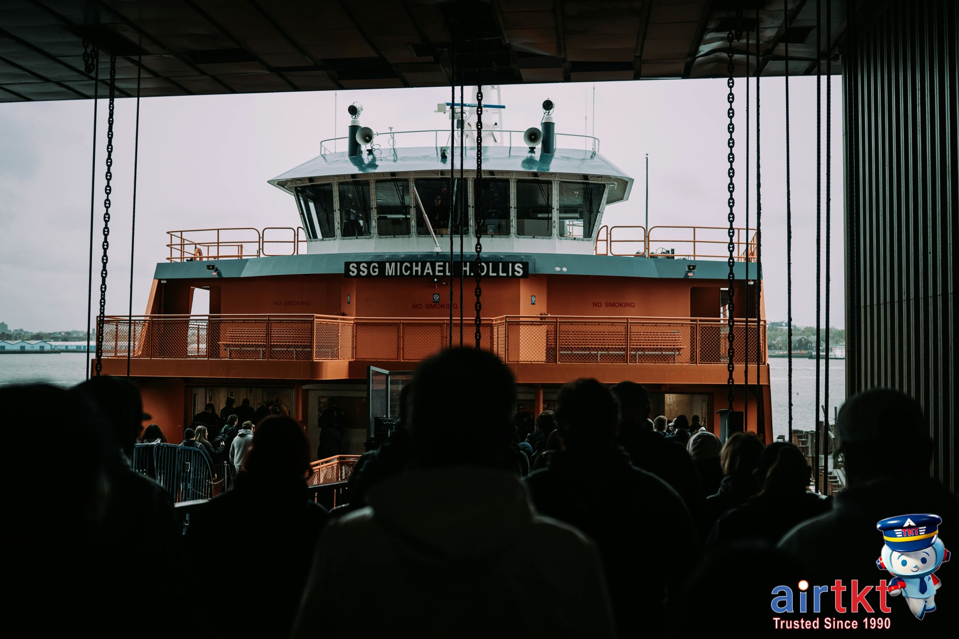 NYC ferry arriving at dock with city skyline in background and passengers waiting