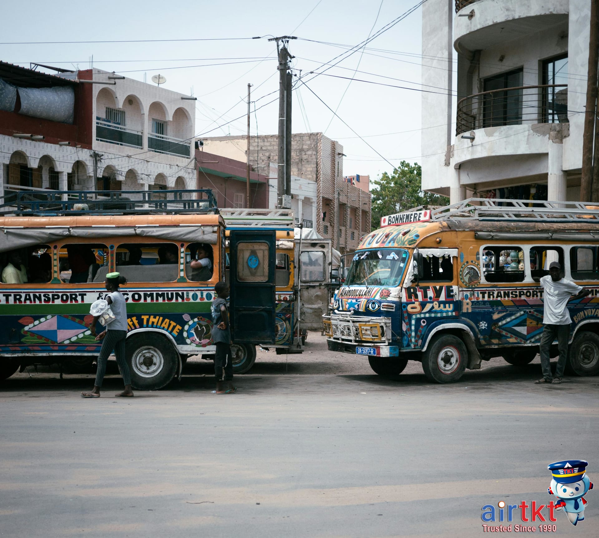 Colorful buses representing affordable transportation options in budget travel cities