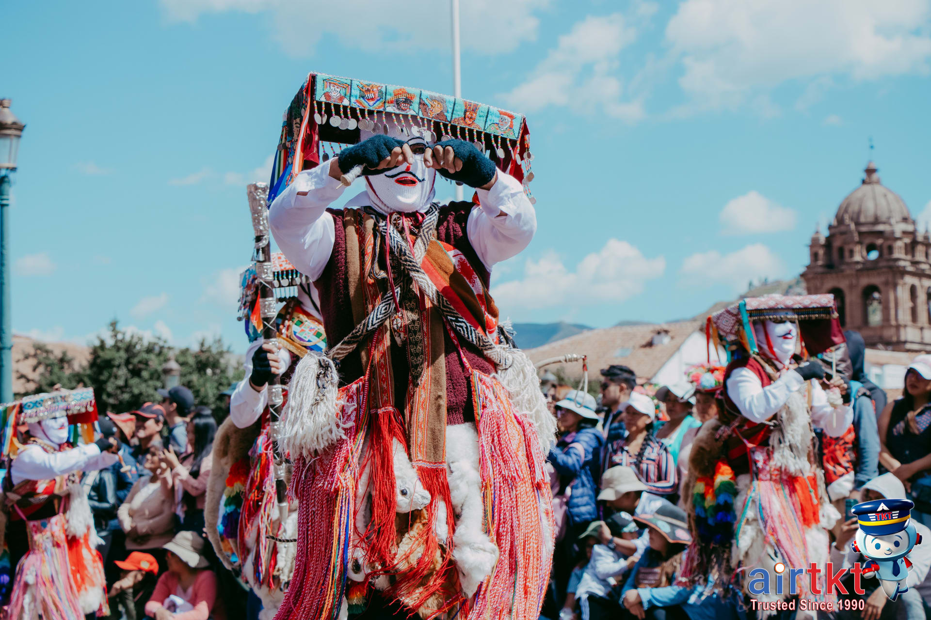 Colorful dancers performing at cultural festival in affordable travel destination