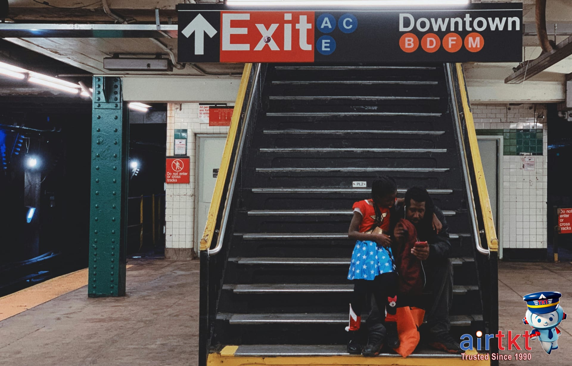 Family riding subway as budget airport transit option and sharing seats together
