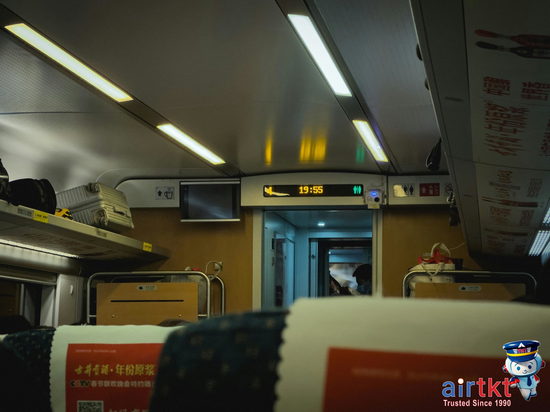 Comfortable train interior with seating for luggage at airport