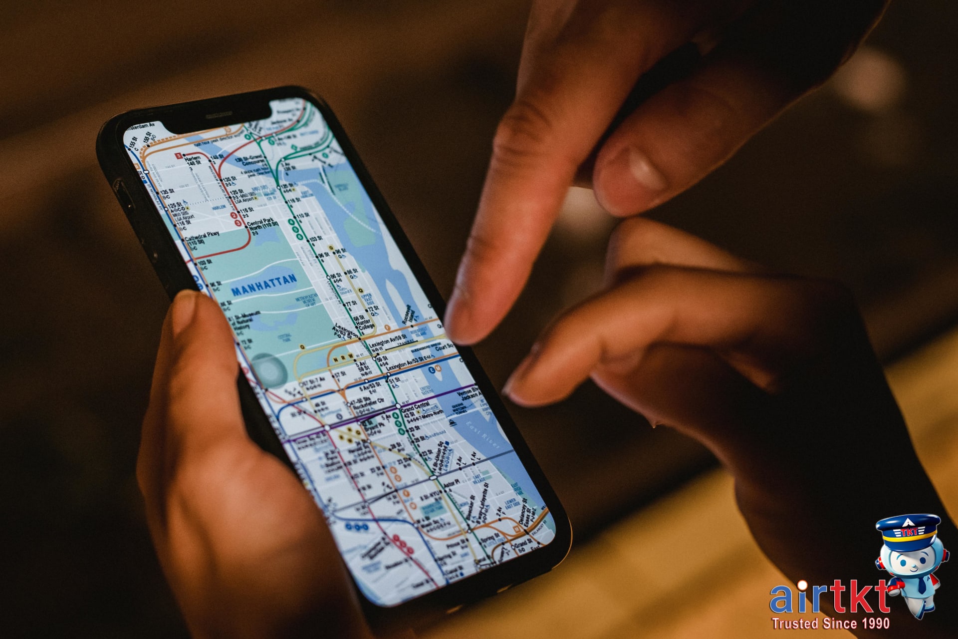 Traveler using smartphone app to book travel deals in New York City