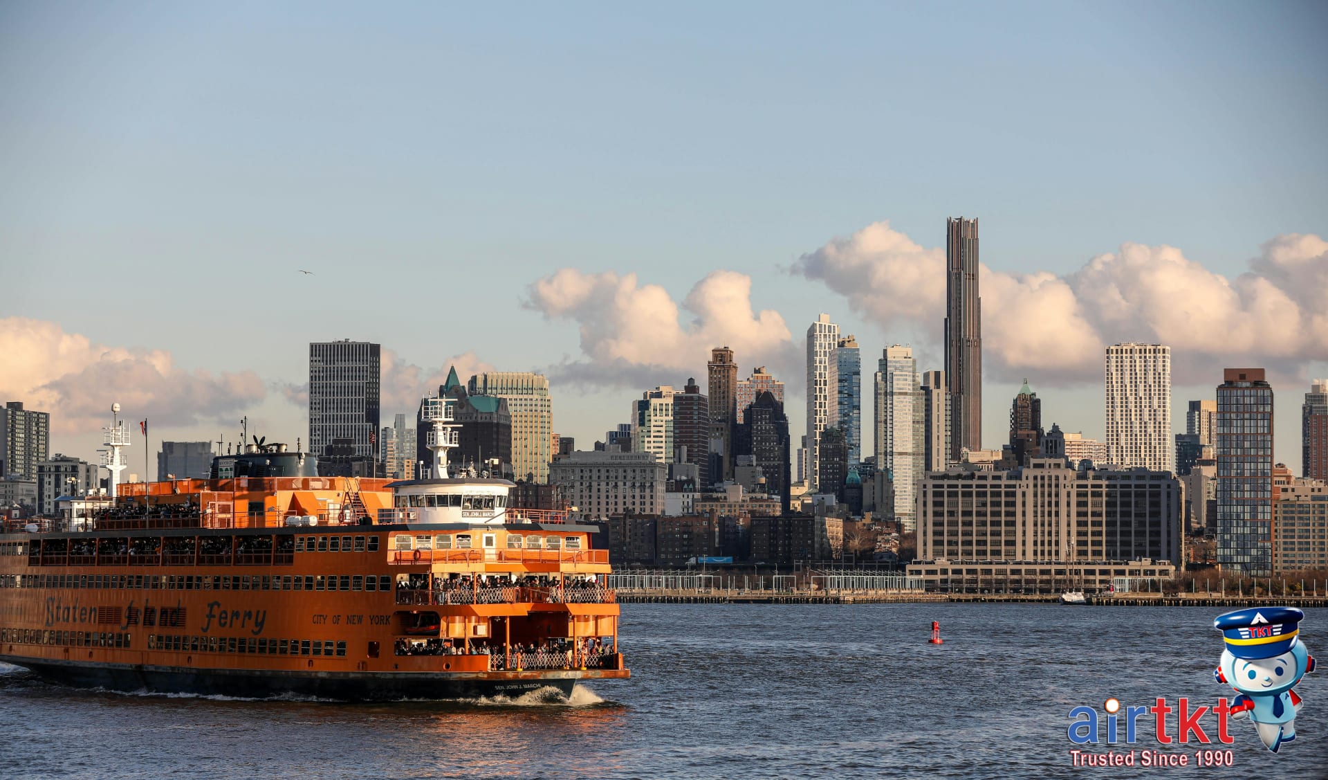 Staten Island ferry crossing New York Harbor with city skyline