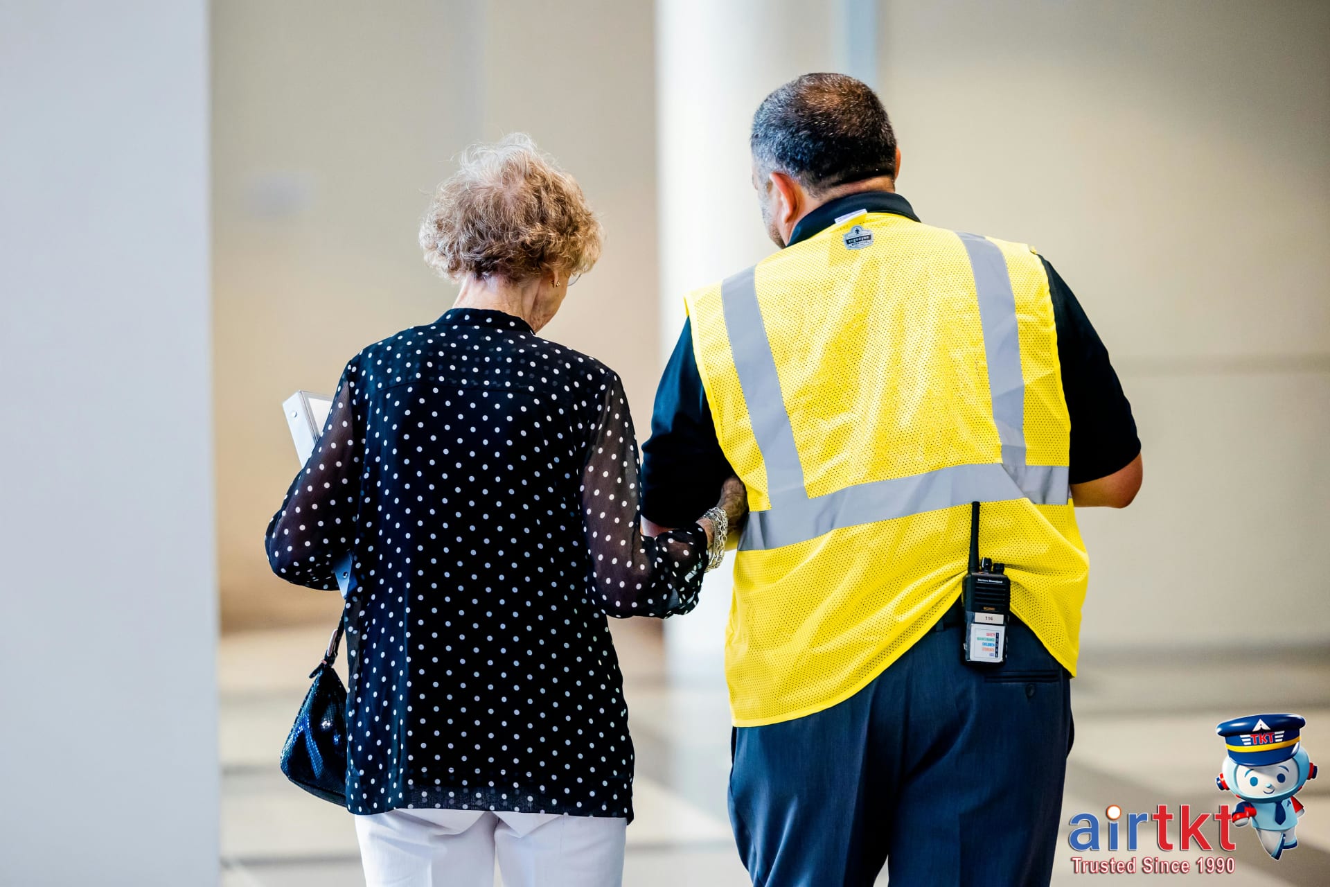 Traveler inquiring about TSA security tips at airport information desk
