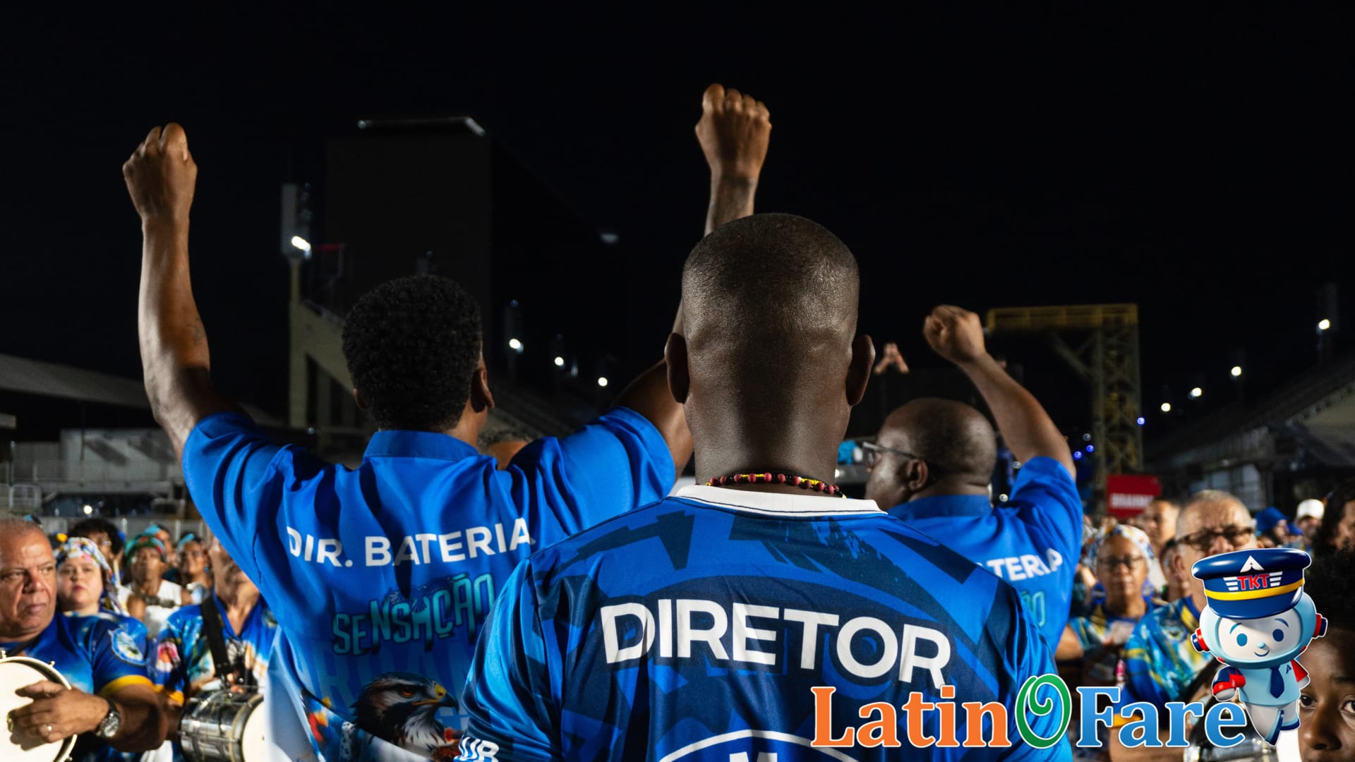 Security staff and festival-goers at the Rio Sambadrome entrance during Carnival parade events.