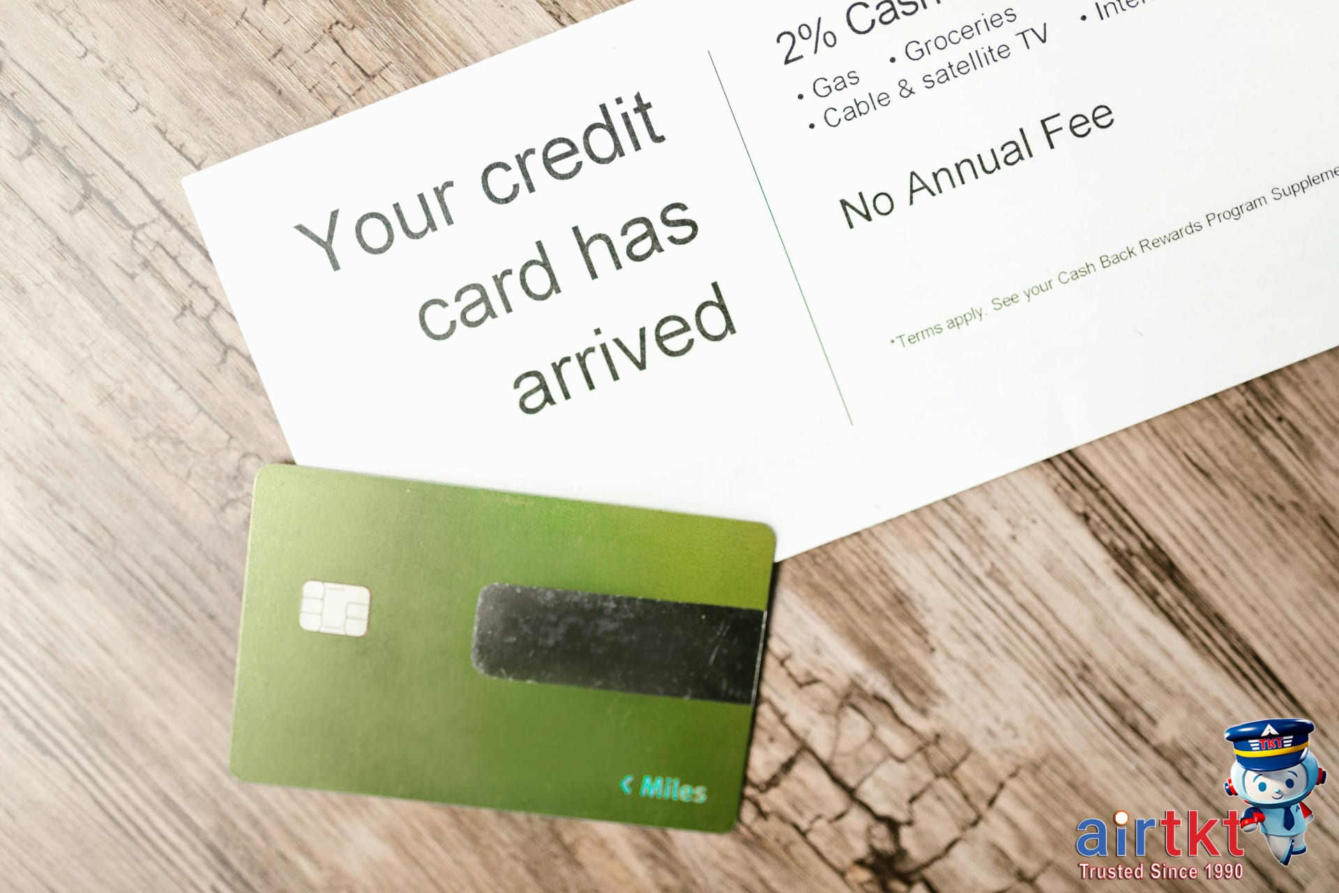Hotel rewards credit card resting on document with financial data