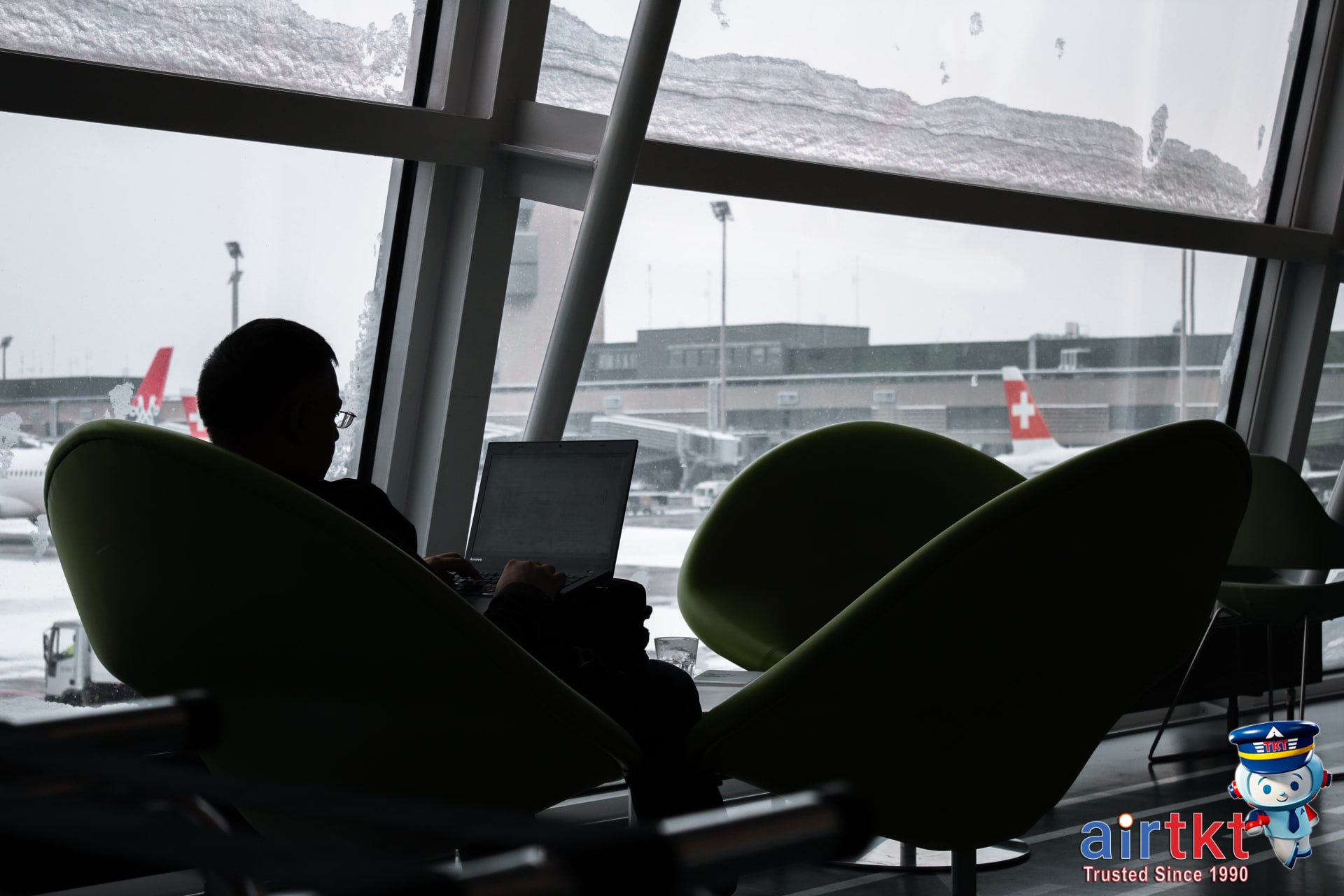 Traveler checking multi-city flight booking confirmations on laptop
