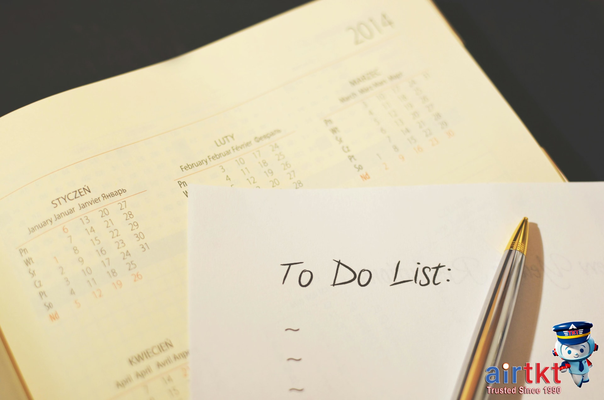 Planning multi-city itinerary on calendar checklist for budget travel
