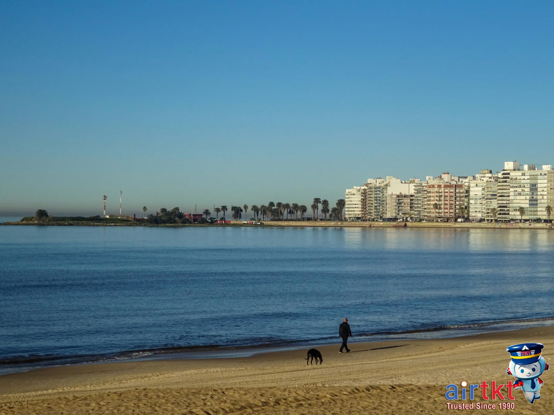 Montevideo Rambla pedestrian and cyclist activity on sunny day, ideal for first-timers.