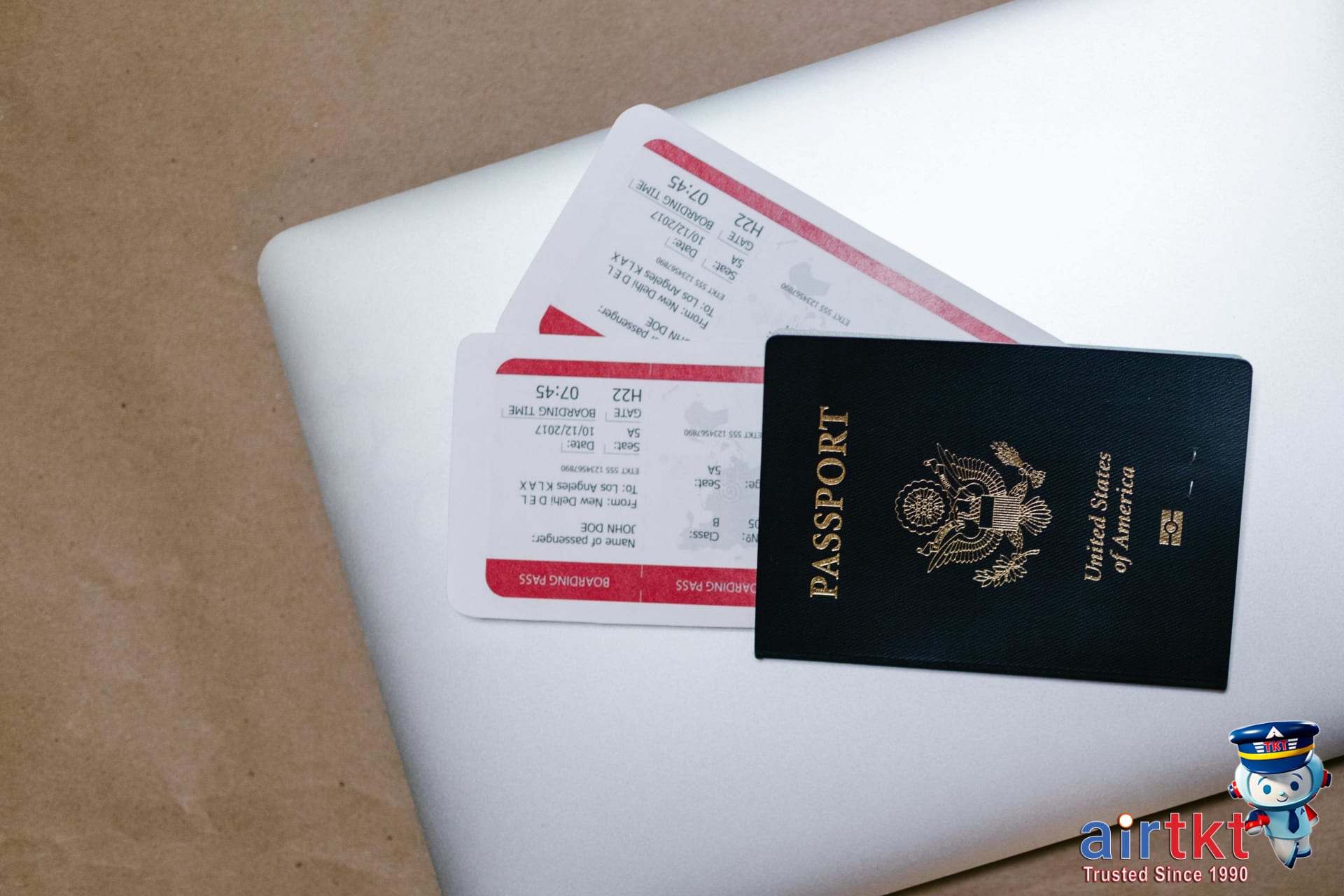 Booking Juneteenth travel deals with AirTkt online using laptop.