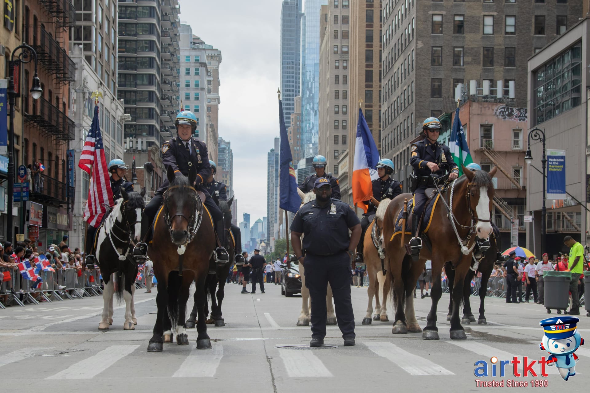 Mounted police officers ensuring crowd control safety during NYC parade day