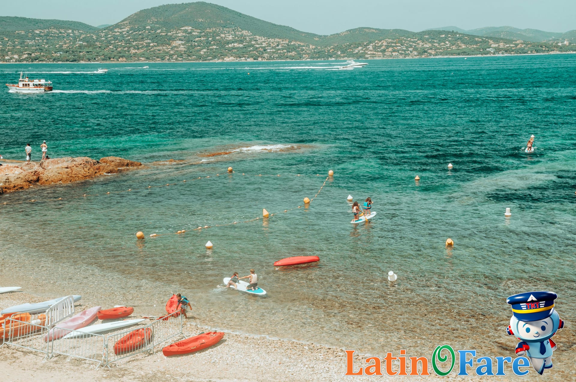Kayaking and paddleboarding on a Mediterranean beach in Europe, favorite summer activities beyond sunbathing.