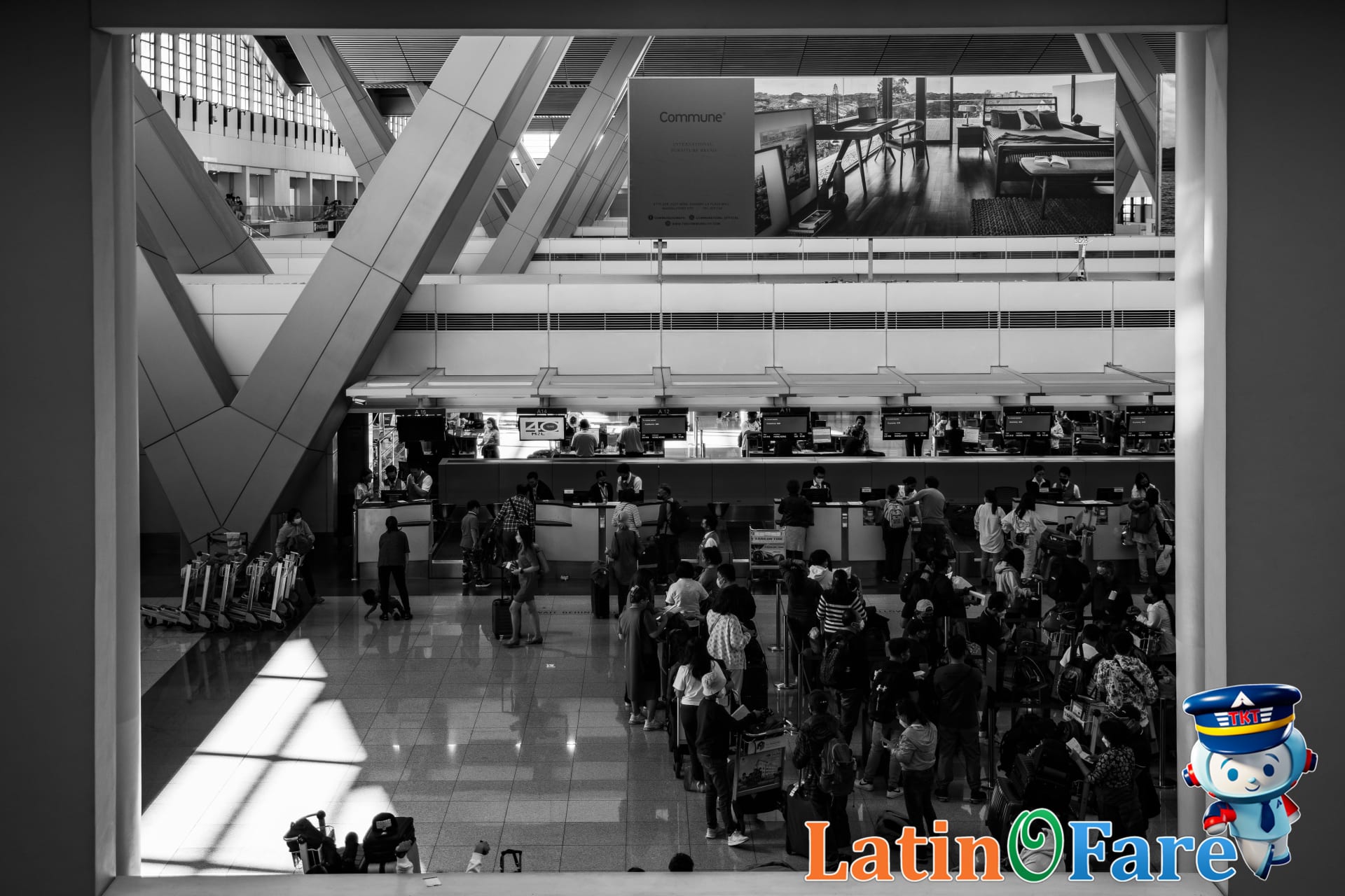 Global Blue VAT refund counter in major airport terminal busy with travelers and shoppers