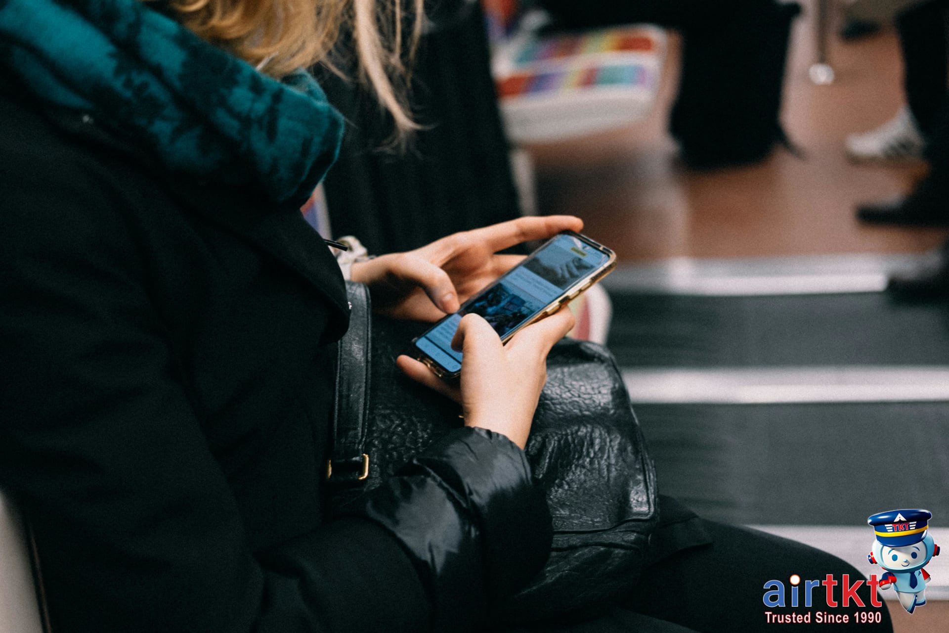 Traveler receiving mistake fare alerts on smartphone in public transit